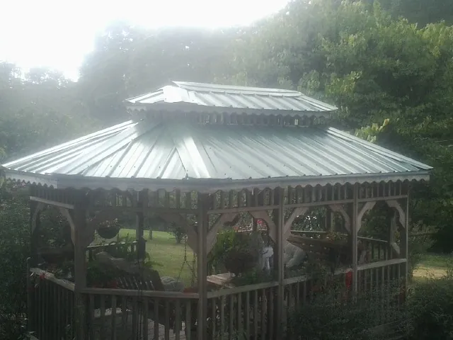 Two tier green metal roof on a garden gazebo in Litchville